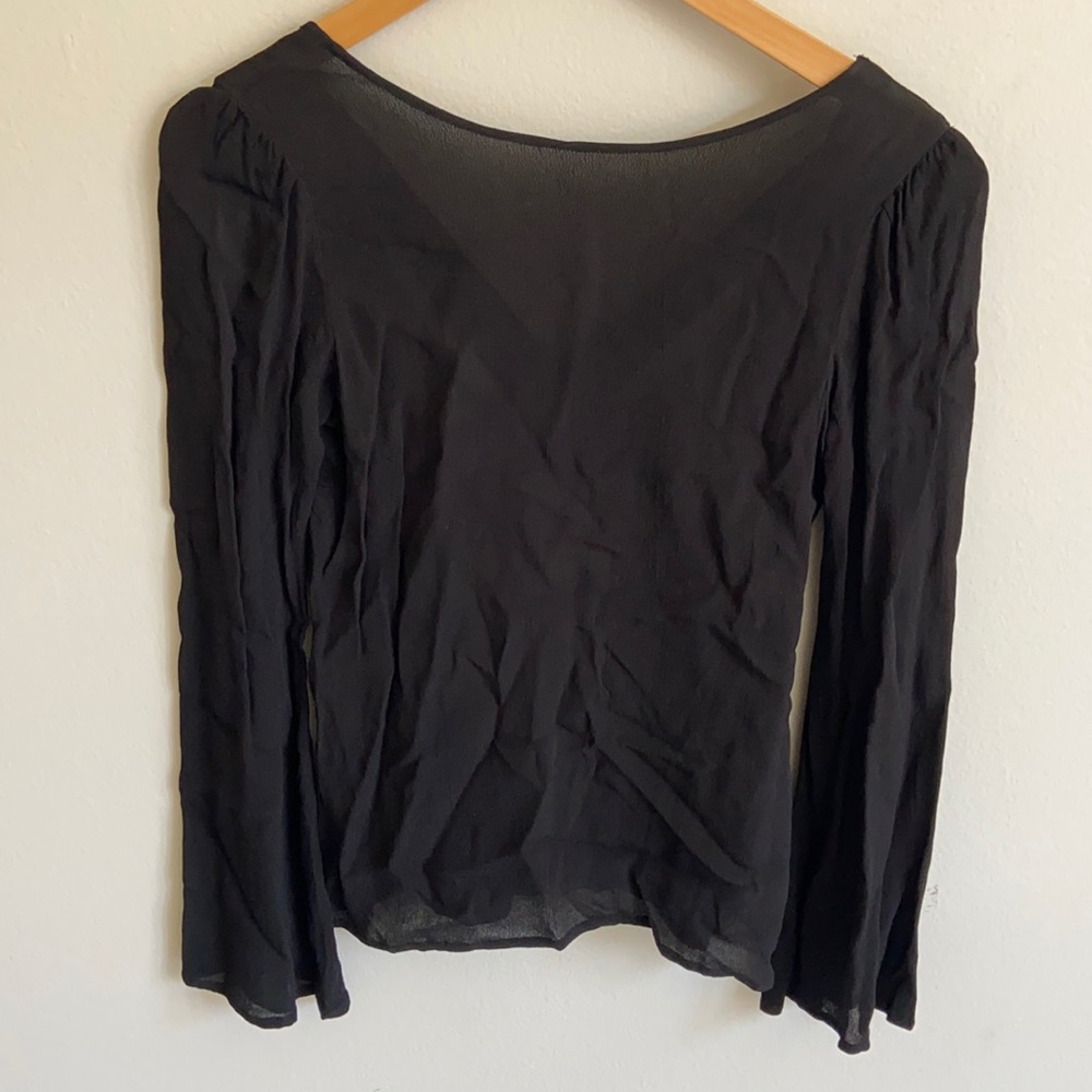 Black long sleeve blouse with cut back details